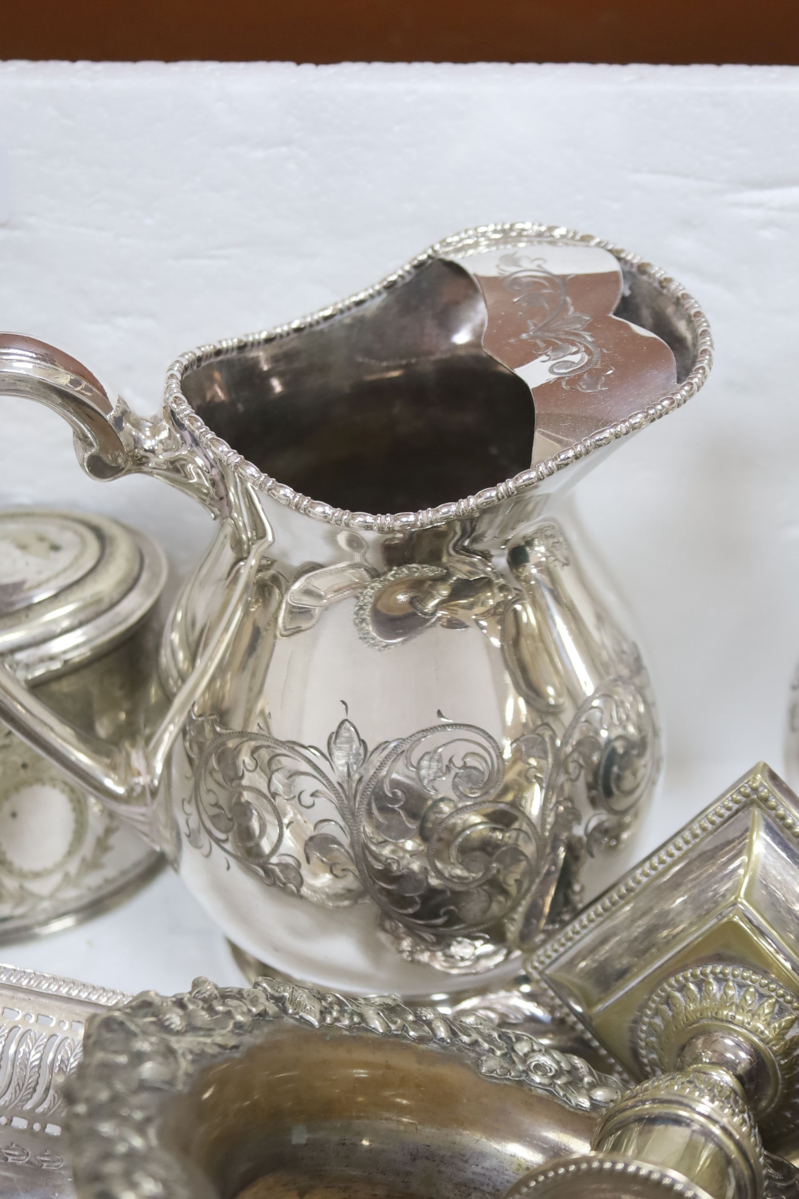 Assorted plated ware including pair of lemonade jugs, two pairs of sauceboats, tea caddy and wine coasters